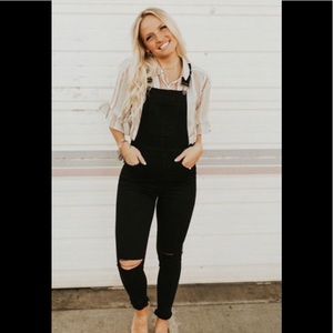 Black overalls with destruction